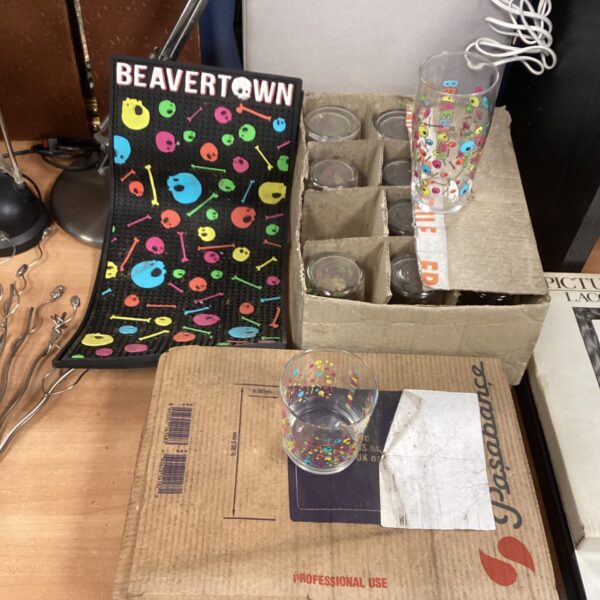 Beavertown bar runner and boxes of branded glasses for sale.