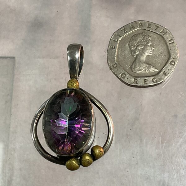 Silver pendant with vibrant mystic topaz gemstone.