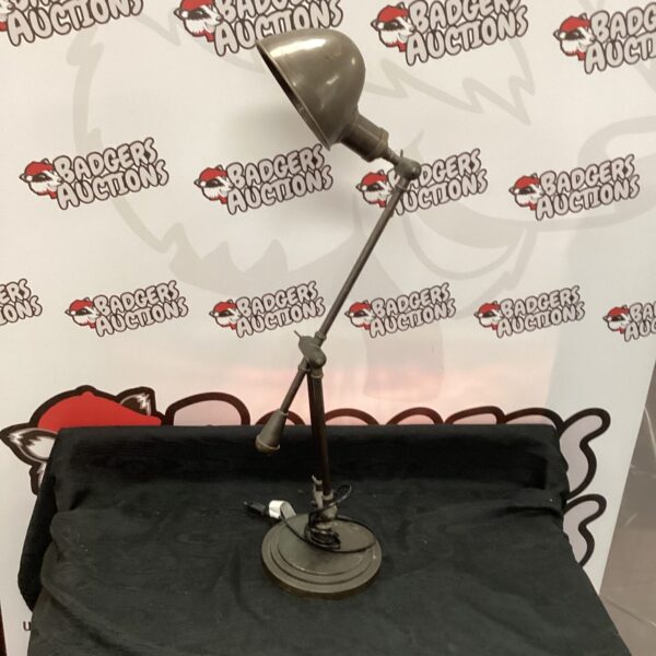 Vintage metal adjustable desk lamp for task lighting.