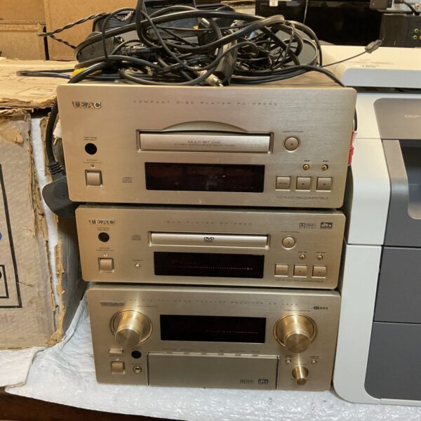 Silver vintage Teac hifi system with CD player and receiver.