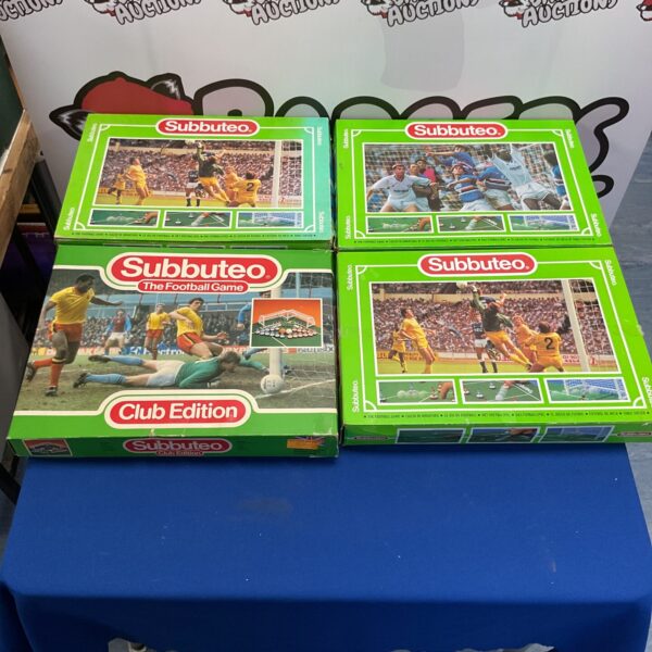 Stacked vintage Subbuteo football sets in boxes.