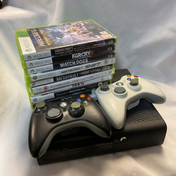 Microsoft Xbox 360 console with game discs for Minecraft, Far Cry 4, and Need for Speed.