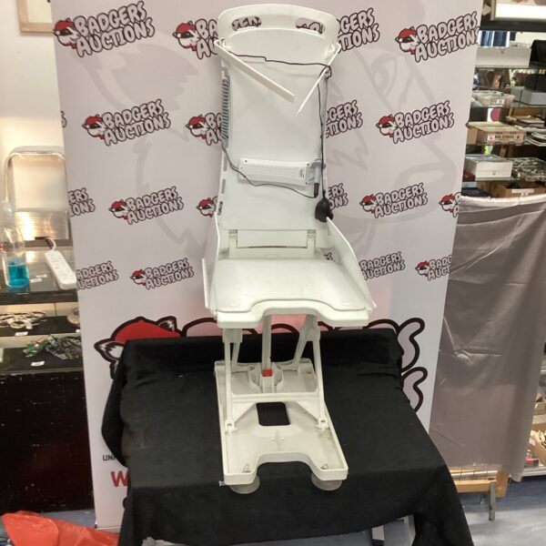 Used bath chair riser with controller for assisted bathing.