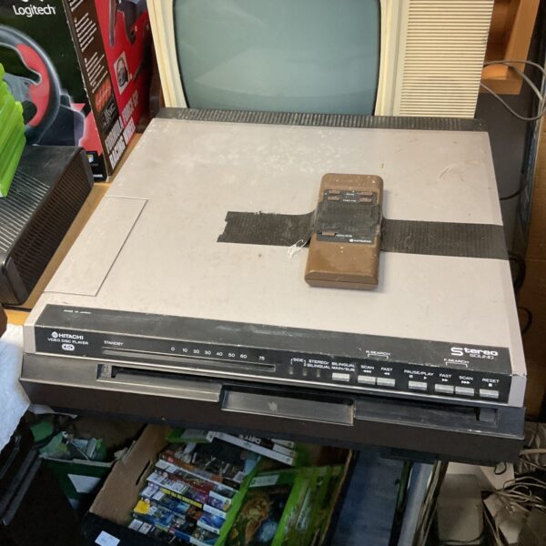 Vintage Hitachi video disc player with remote control.