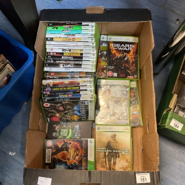 A lot of Xbox 360 games in cases, ready for gaming.