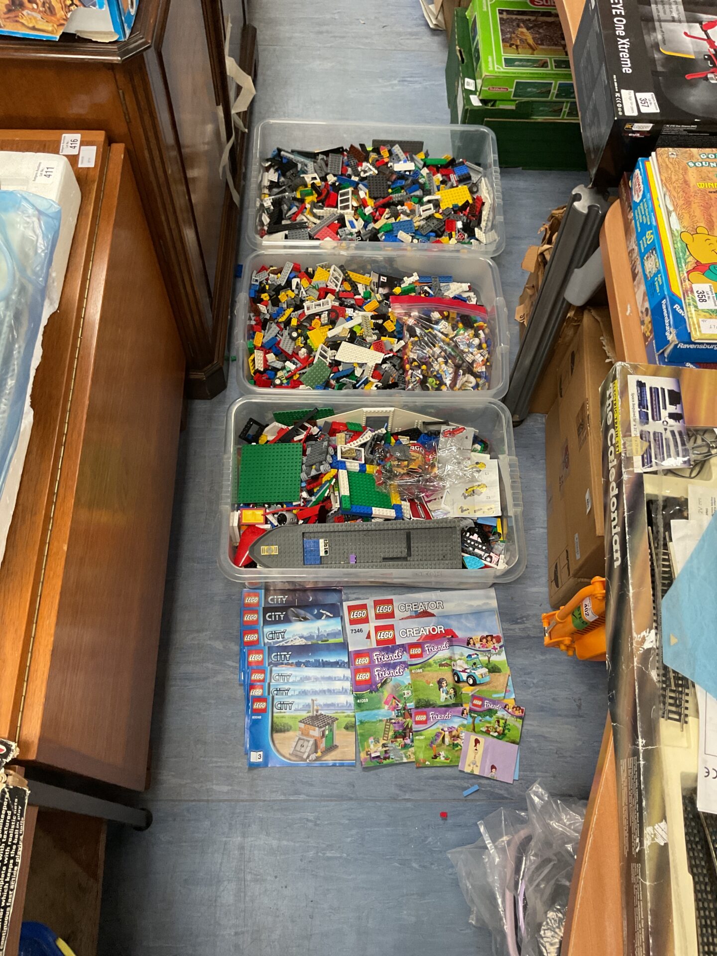 405 Three large crates of mixed Lego inc manuals and some figures