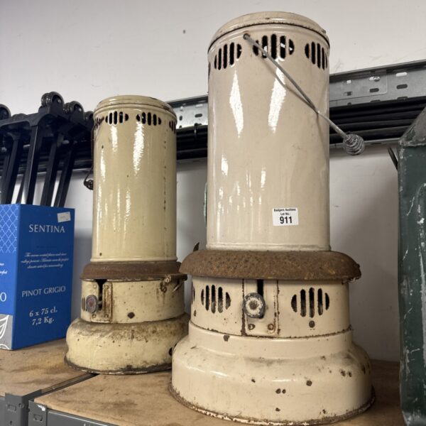Vintage cast iron greenhouse heater, antique garden heating appliance.