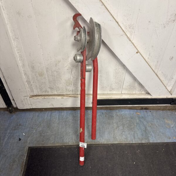 Red Rothenberger pipe bender for 15mm and 22mm tubing.