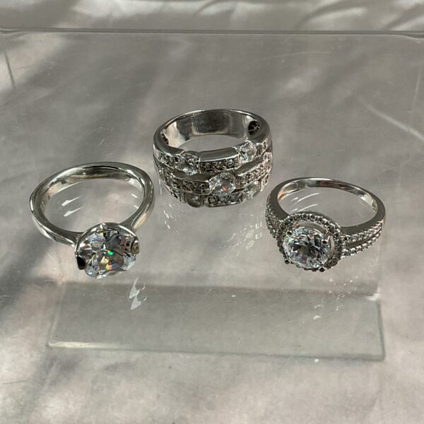 Silver CZ ring set in sizes M and O.