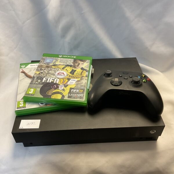 Microsoft Xbox One console and controller presented for sale.