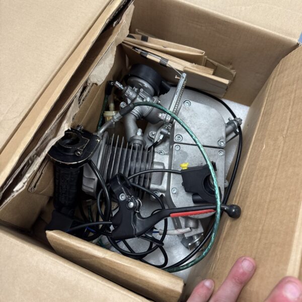 Bicycle engine kit featuring a 2-stroke engine for modification.