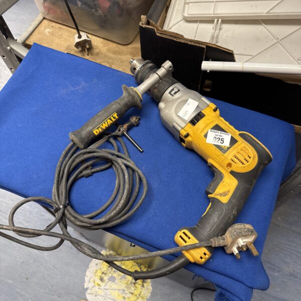 Close-up of a Dewalt hammer drill, showing its features.