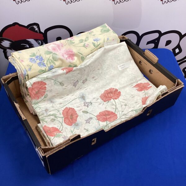 Floral duvet set with double and single covers and pillowcases.