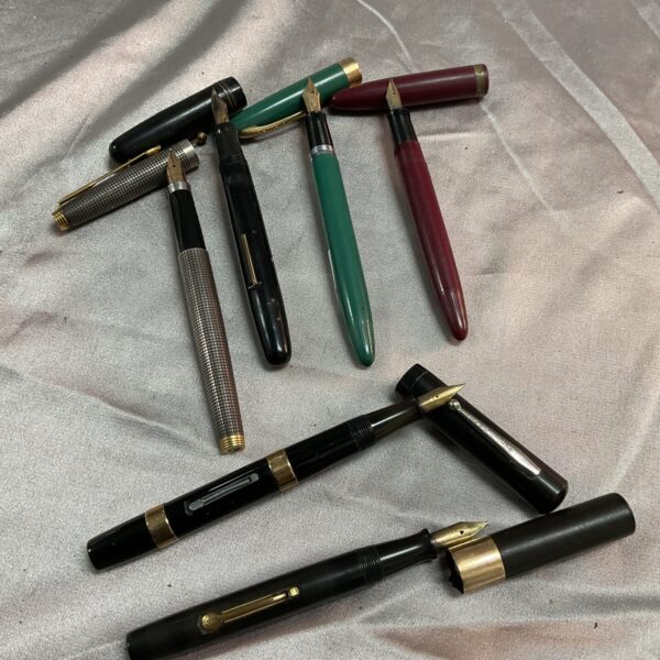 Vintage fountain pen lot with silver and gold fittings.