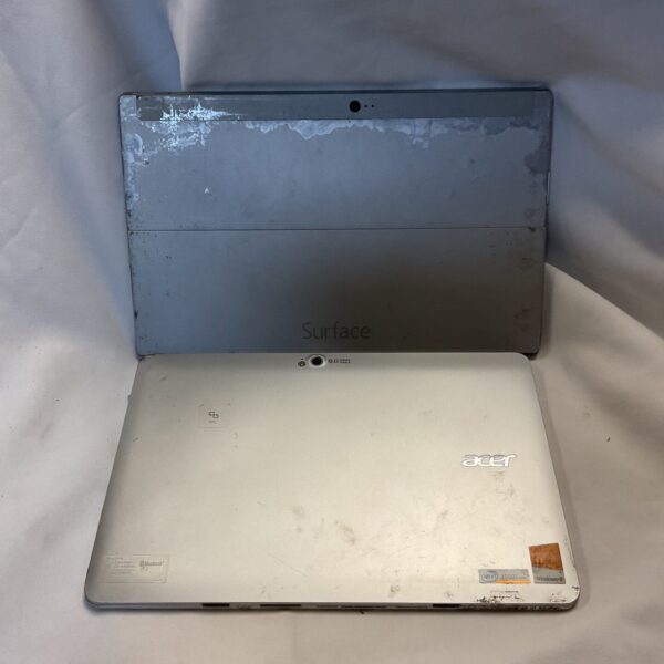 Front view of a Microsoft Surface and Acer tablet.