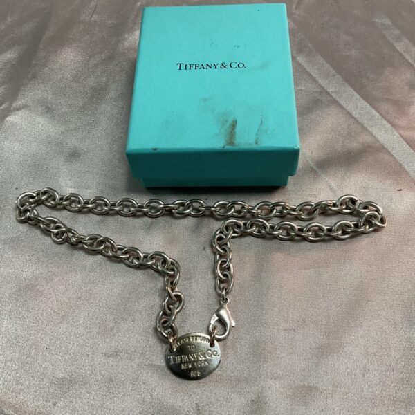 Tiffany & Co. silver choker necklace on a blue box.