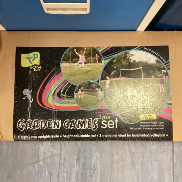 Colourful garden game set for badminton and volleyball in box.