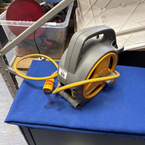 Hozelock garden hose reel for outdoor watering and storage.