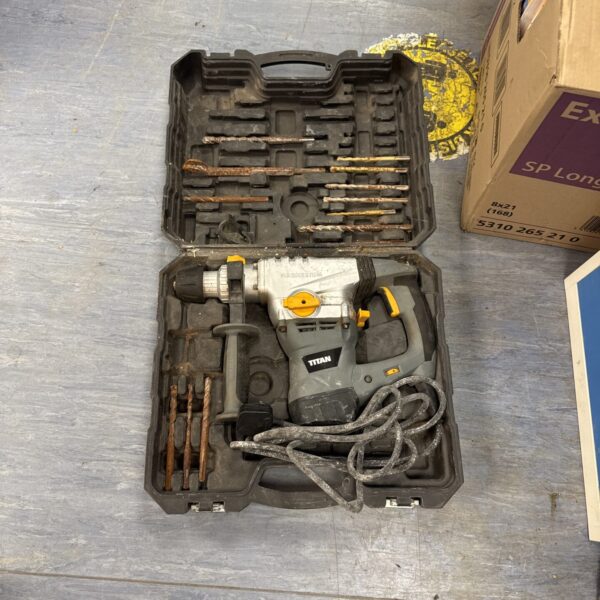 Titan SDS drill in open case, showing drill and accessories.