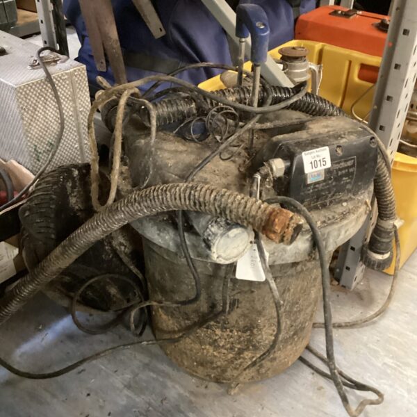 Used pond pump filter for garden pond maintenance.
