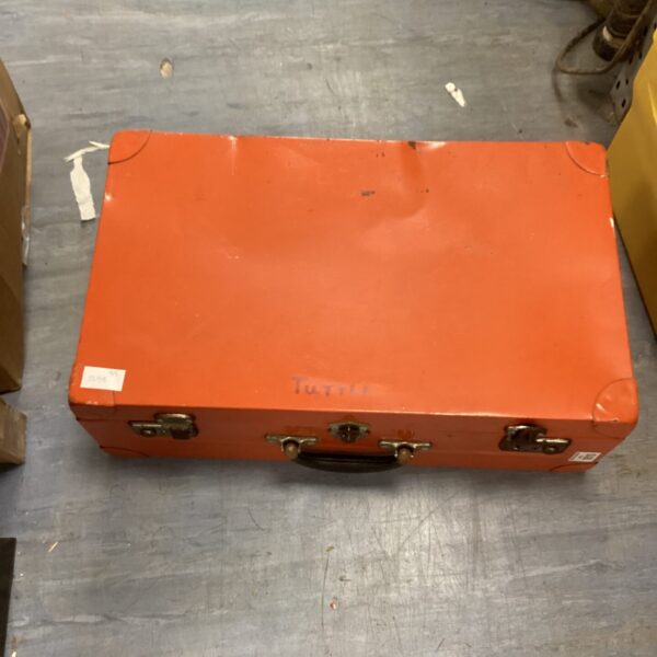 Vintage metal tool box with a carrying handle.