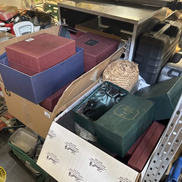 Assorted empty cardboard boxes stacked for storage and shipping.