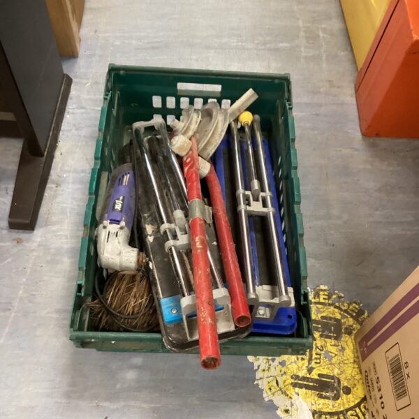 Mixed tool lot featuring a pipe bender and various hand tools.