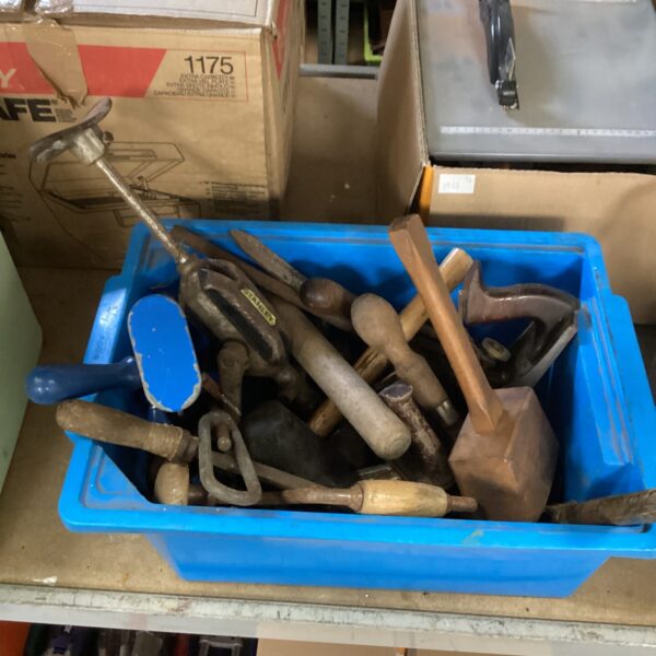 Vintage hand tools lot in a storage container, ideal for collectors.