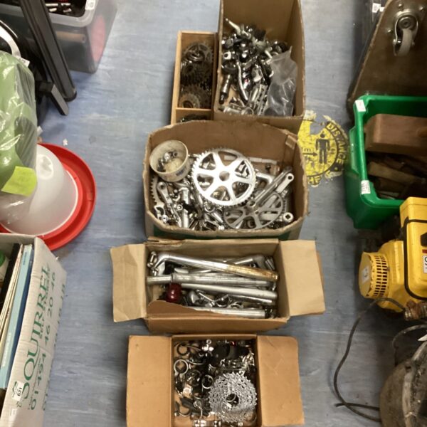 Large lot of bicycle spares and gear cogs for repair projects.