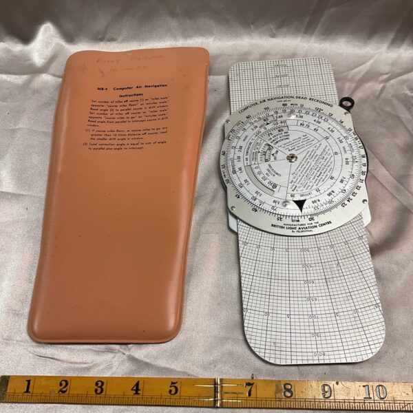 Front view of vintage Mb-4a air navigation computer with instructions.