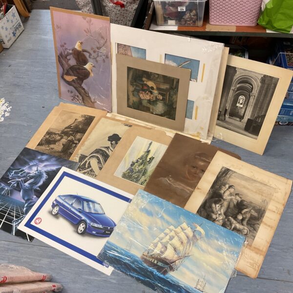 Assortment of vintage prints and artwork for collectors.