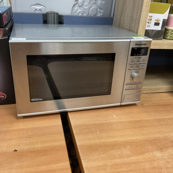Stainless steel Panasonic inverter microwave oven for kitchen use.