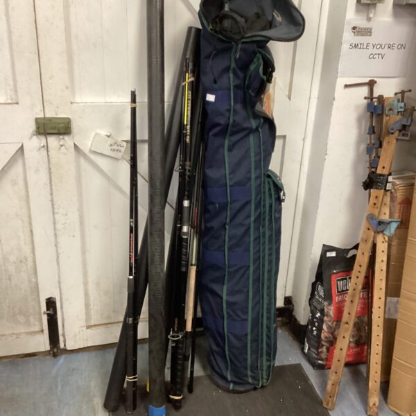 Shakespeare fishing bag containing multiple fishing rods and tackle.
