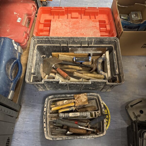 Large plastic toolbox filled with various hand tools for DIY projects.