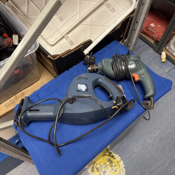 Ferm reciprocating saw and Black & Decker drill power tools.