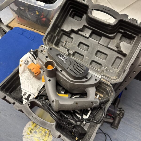Titan electric planer in a case, woodworking power tool.
