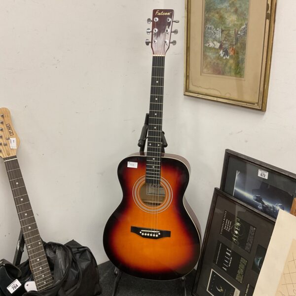 Vintage Falcon F300SB acoustic guitar with sunburst finish.