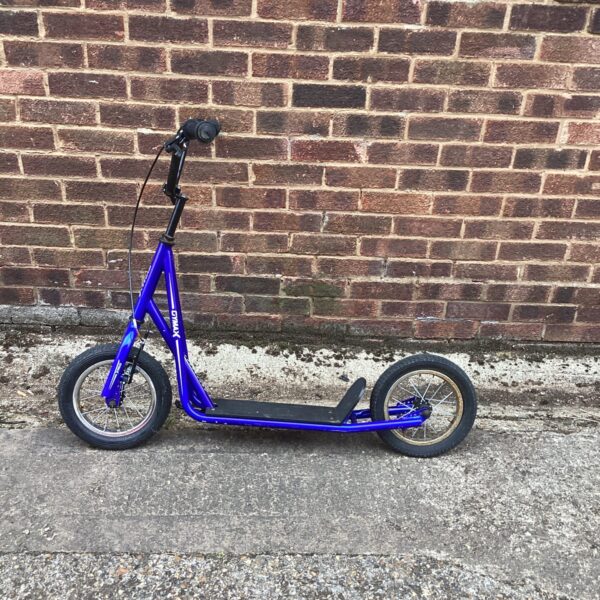 Bright blue Cymax scooter, vintage retro ride-on toy.