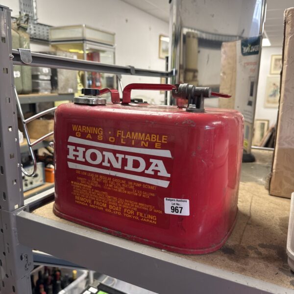 Vintage red and white Honda fuel can for boat or outboard motors.