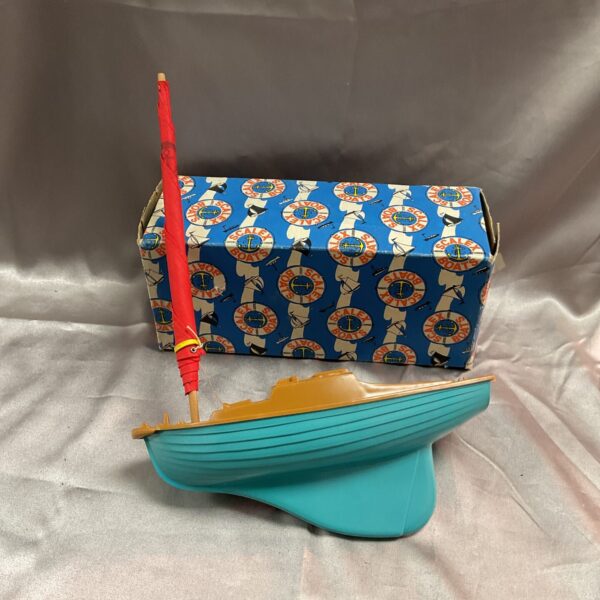 Vintage Scalextric Jolly Boat in original box, side view.