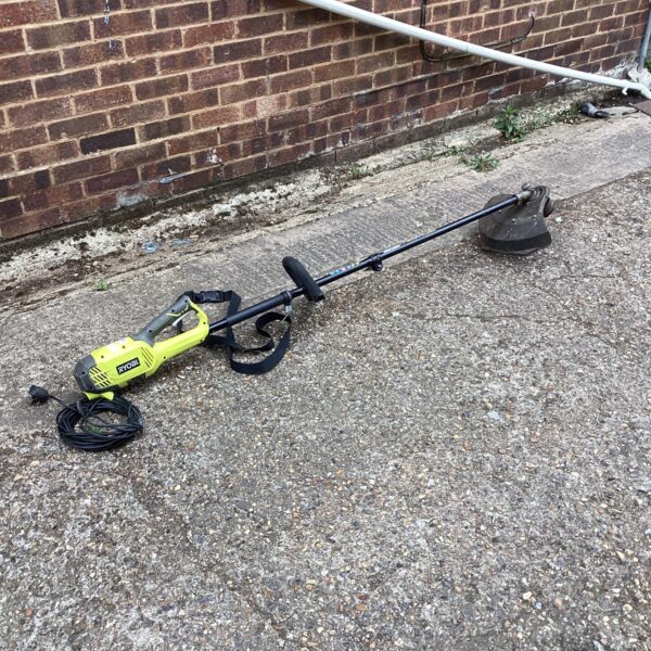 Ryobi electric garden strimmer for lawn and garden maintenance.