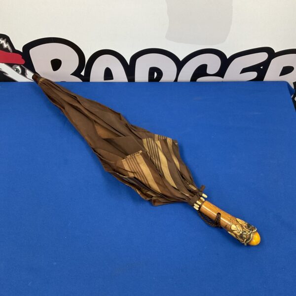 Vintage brown fabric ladies umbrella with wooden handle.