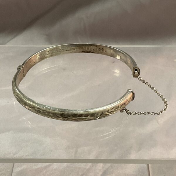 Intricate antique silver hinged bracelet with hallmarking.