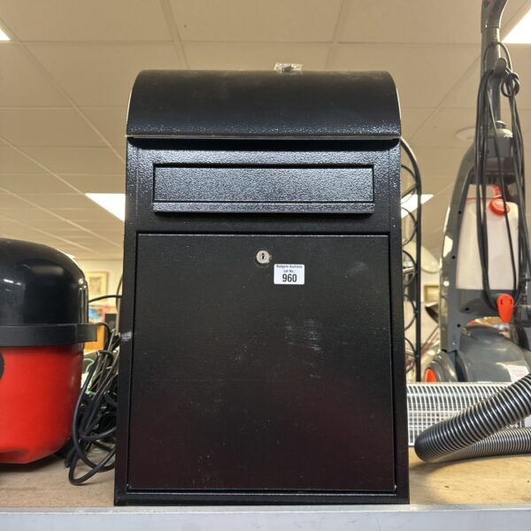 Tall vintage metal mailbox with keys, ideal for collectors.