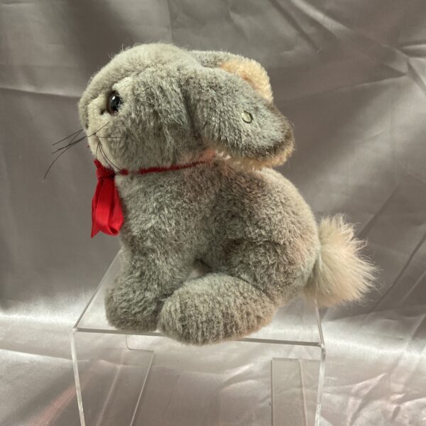 Vintage grey Steiff bunny rabbit with red ribbon.