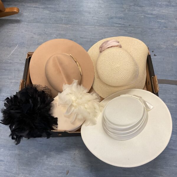 Vintage ladies hats lot featuring straw and felt designs.