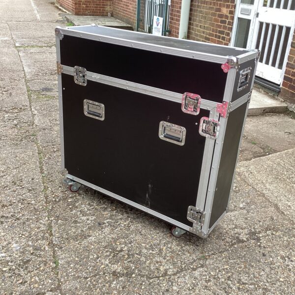 Large aluminium flight case on wheels for equipment transport.