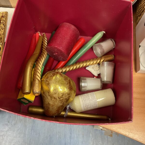 Assorted vintage and decorative candles in a mixed candle lot.