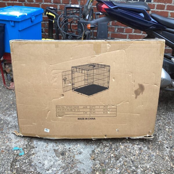 New animal transport cage still sealed in its original box.