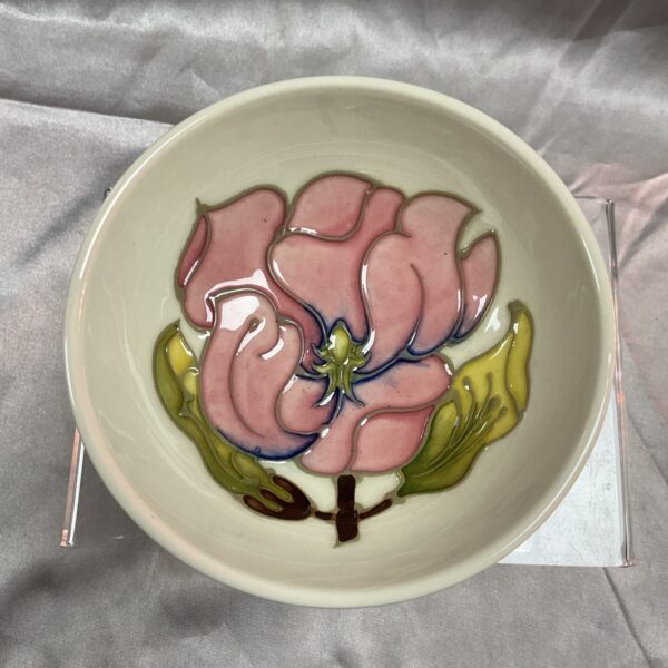 Front view of a Moorcroft magnolia bowl with floral design.